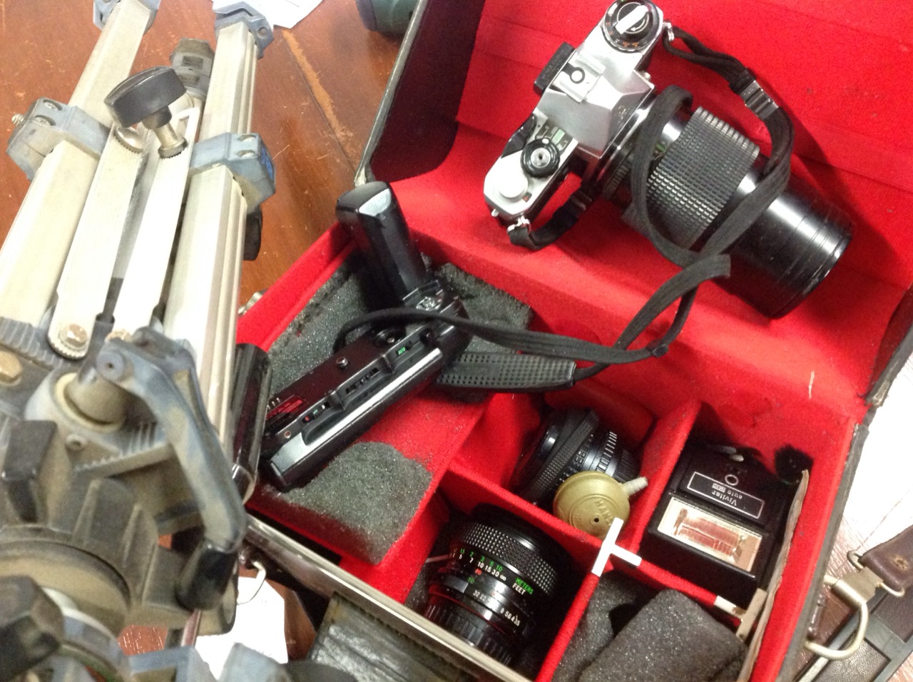 A quantity of cased Pentax camera gear including lenses, ME camera & winder, flash unit, fitted