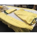 A pair of lined yellow cotton bedcovers with matching valances, the pieces with green trims. (4)