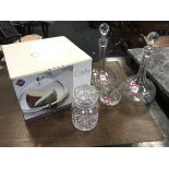 Two sherry decanters with cut ball stoppers; a boxed glass cheese dome; a foliate etched glass vase;