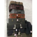 Eight miscellaneous suitcases - Revelation, Antler, soft, faux leather, etc. (8)