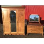 A late Victorian mahogany wardrobe & matching dressing table, the robe with quarter veneered doors