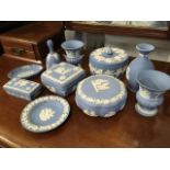 Ten pieces of blue Wedgwood jasperware - vases, boxes & covers, pin trays, a bell, etc. (10)