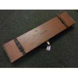 A Holland & Holland leather gun case with brass mounts and leather straps, having baize lined
