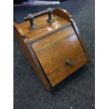 A late Victorian coal box, the reeded angled lid with brass knob, the top with bobbin turned handle.