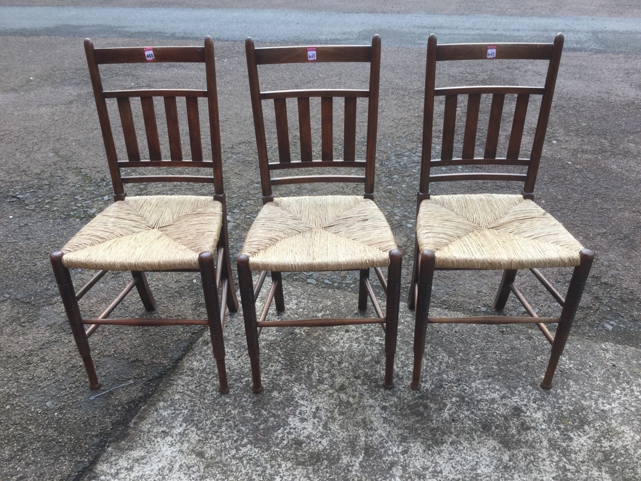A set of three William Birch rush seated chairs, the rounded backs with slats, raised on ring-turned - Image 2 of 3