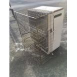 A Super Ser portable gas heater on casters, with protective cage.