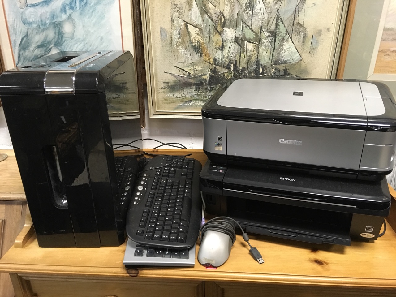 An Epson Stylus SX218 printer/copier; a large Fellows paper shredder; two computer keyboards; a