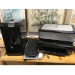 An Epson Stylus SX218 printer/copier; a large Fellows paper shredder; two computer keyboards; a