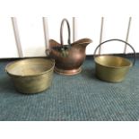 A Victorian brass jam pan with iron swing handle; another similar with channelled riveted handle;