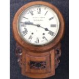 A Victorian walnut cased drop-dial wallclock, having enamelled dial with roman chapters by