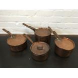 A set of four nineteenth century copper saucepans & covers, riveted with iron handles. (4)