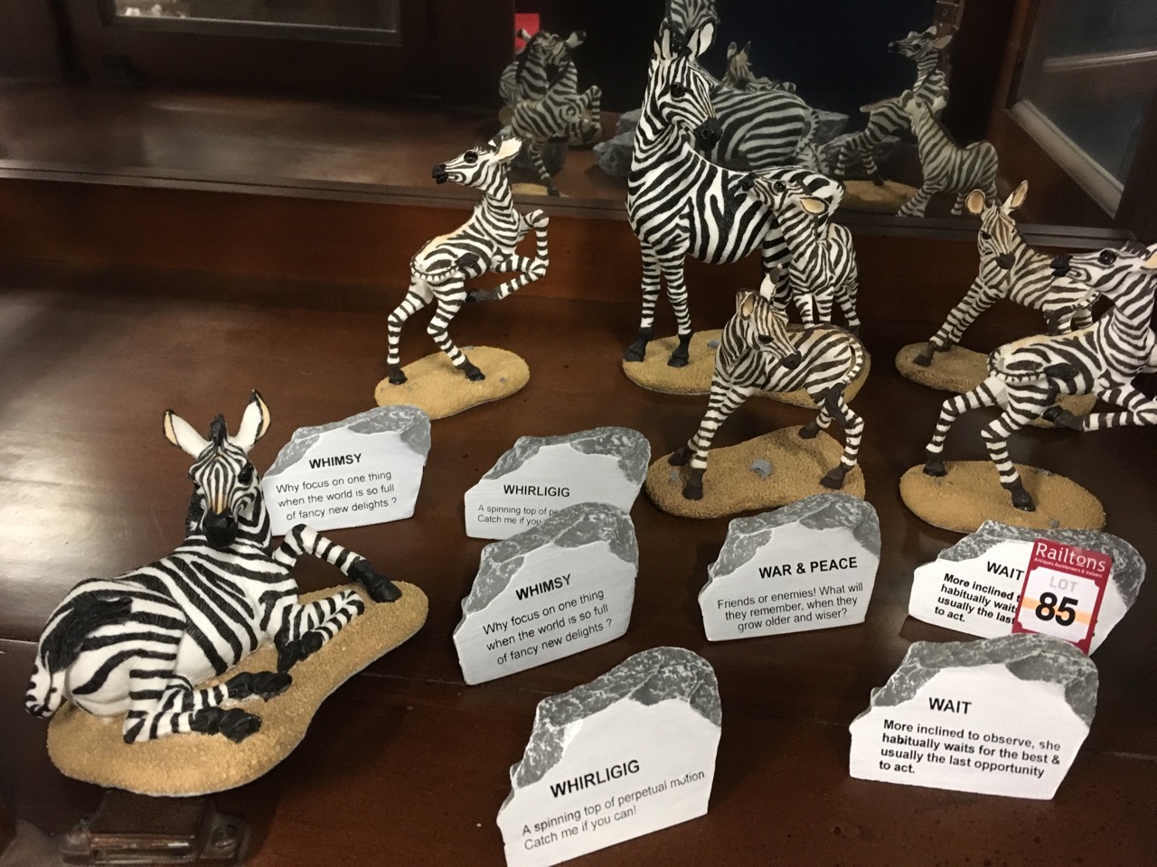 A collection of zebras with accompanying titles on faux rocks; a similar elephant and tiger model - Image 3 of 6