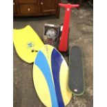 Two surfing boards; a snow scooter with hinged handlebars; a boxed Bell safety helmet; and a