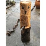 A carved owl, cut from a solid ash limb, the bird on column with scorched & painted decoration. (