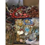 A quantity of costume jewellery including necklaces, brooches, pendants, chains, beads, some old