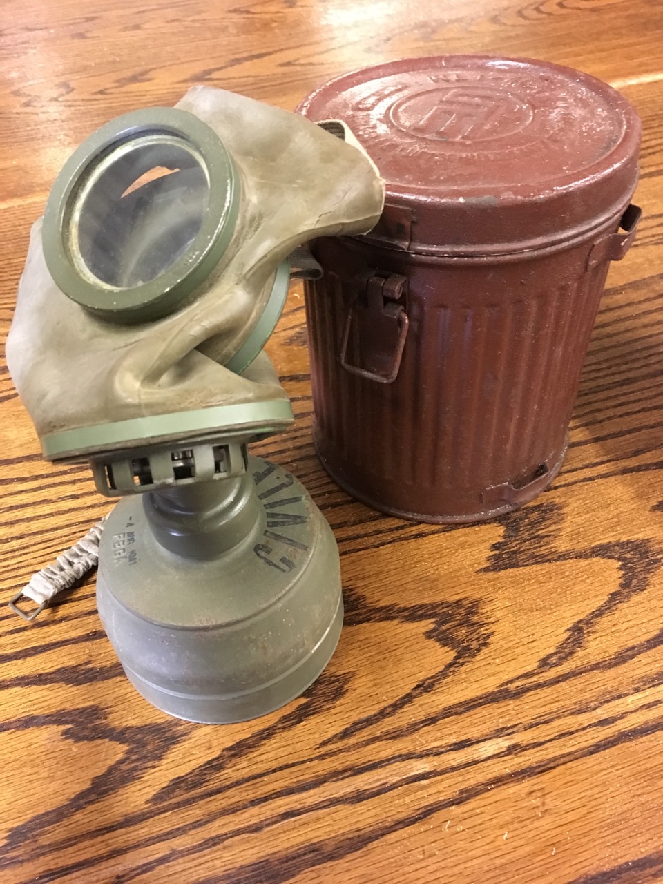 A 1941 German gas mask in original tubular ribbed can with hinged lid; and a rectangular iron box - Image 3 of 6