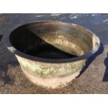 A large Victorian Falkirk foundry circular cast iron boiling tub of cauldron form with flat rim.