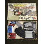 A boxed Speedmark auto racing set with track, two cars, controllers, etc.