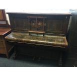 A faux walnut upright piano by H Hicks, with foliate marquetry inlay to case, having seven octave