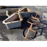 A set of three triangular galvanised horse feeders, the troughs with flat rims; and four cast iron