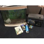 A bowfronted AquaOne glass aquarium complete with lights, heater, instruction manuals, etc; and a