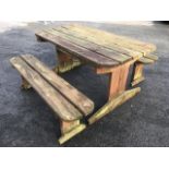 A garden table and bench set of bolted construction, with slatted top and seats on sledge feet. (3)