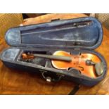 A cased childs violin & bow - half size.