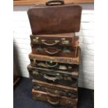 Seven miscellaneous vintage suitcases, some leather, one gladstone type, LNER labelled, some with