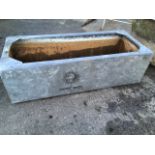 A rectangular 3ft 6in galvanised tank with flat rim.