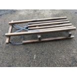 A Murton childs sledge with iron runners and slatted hardwood seat.