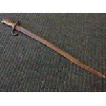 A French Chassepot Yataghan bayonet, with long curved channelled blade and ribbed brass handle -