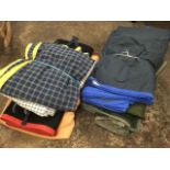 A quantity of equestrian rugs including field rugs, stable blankets, exercise/sweat sheets,