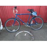 An Emmelle gents Cortina bicycle with spare mudguards, canvas panier, wide sprung seat, twin