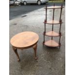 A circular quarter veneered walnut coffee table raised on cabriole legs; and a reproducion whatnot