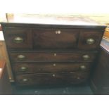 A nineteenth century mahogany secretaire chest, the desk drawer with fitted interior of