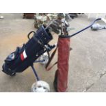 A set of golf clubs in Sayers bag mounted on Titleist trolley; and a set of Dunlop golf clubs in