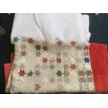 A Victorian patchwork quilt sewn with squares and stars within a wide red border; and another