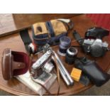 A quantity of cameras and gear including a leather cased German Retina III, lenses, a Minolta