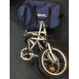 A Citybike, the folding bicycle hardly used, in zip bag with carrying strap.