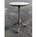 A circular mahogany lamp table, with tray moulded top on twisted column, raised on scrolled tripod