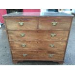 A Georgian mahogany chest of drawers having plate glass to top, with two short and three long