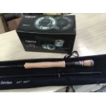 An unused Greys G series 9ft 6in three-piece fly rod in bag, together with a matching boxed Greys