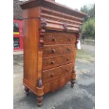 A Victorian mahogany Scotch chest with the angled moulded cornice having hat compartment above two