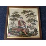 A Victorian woolwork tapestry picture depicting seated young person with cat on mossy bank with