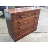 A nineteenth mahogany chest of drawers, the crossbanded top above two short and three long knobbed