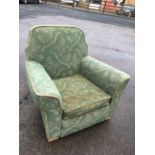 A 50s cut moquette upholstered armchair, the padded back and sprung seat with loose cushion,