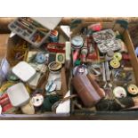 A quantity of fishing tackle including three Wheatley fly boxes, spinners, lines, Devon minnows,