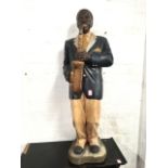 A black saxophonist, the 3ft 6in figure on shaped plinth.
