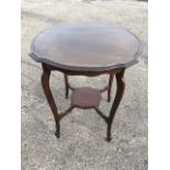 A late Victorian circular scalloped top mahogany occasional table, raised on sabre legs united by