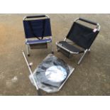 A pair of anglers folding chairs on tubular frames; an unused keepnet with stake; and a landing